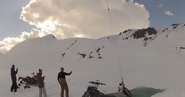 Watch A Snowmobile Get Pulled Out Of A Glacier Lake By A Helicopter