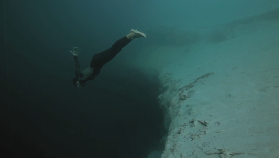 Travel To The Bottom Of The Ocean As A Freediver Descends An Underwater Chasm: Hypnotically Beautiful