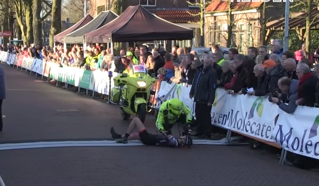 Douchebag alert: This spectator causes pro cyclist to crash during final sprint.